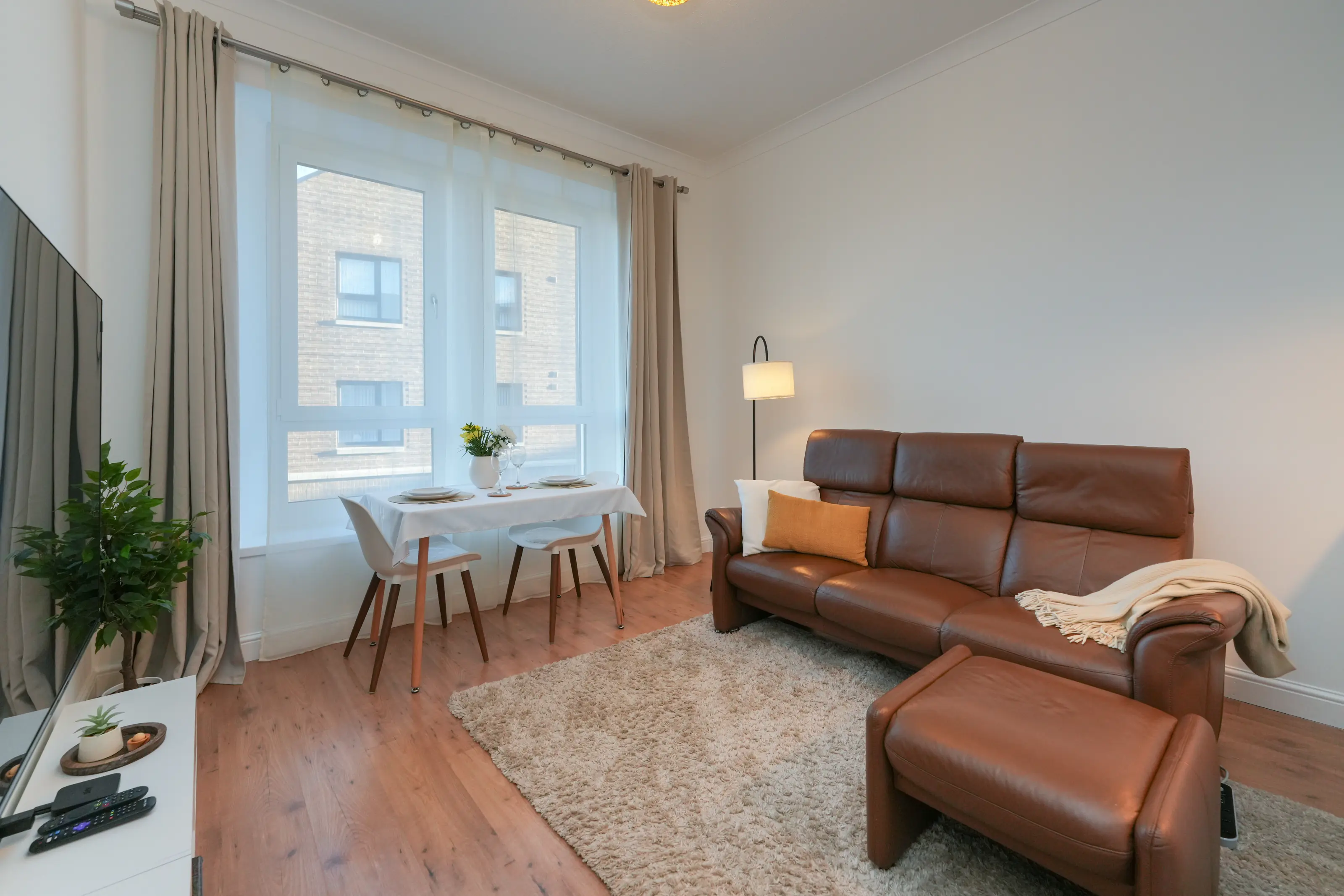 Bright lounge with large windows and natural lighting